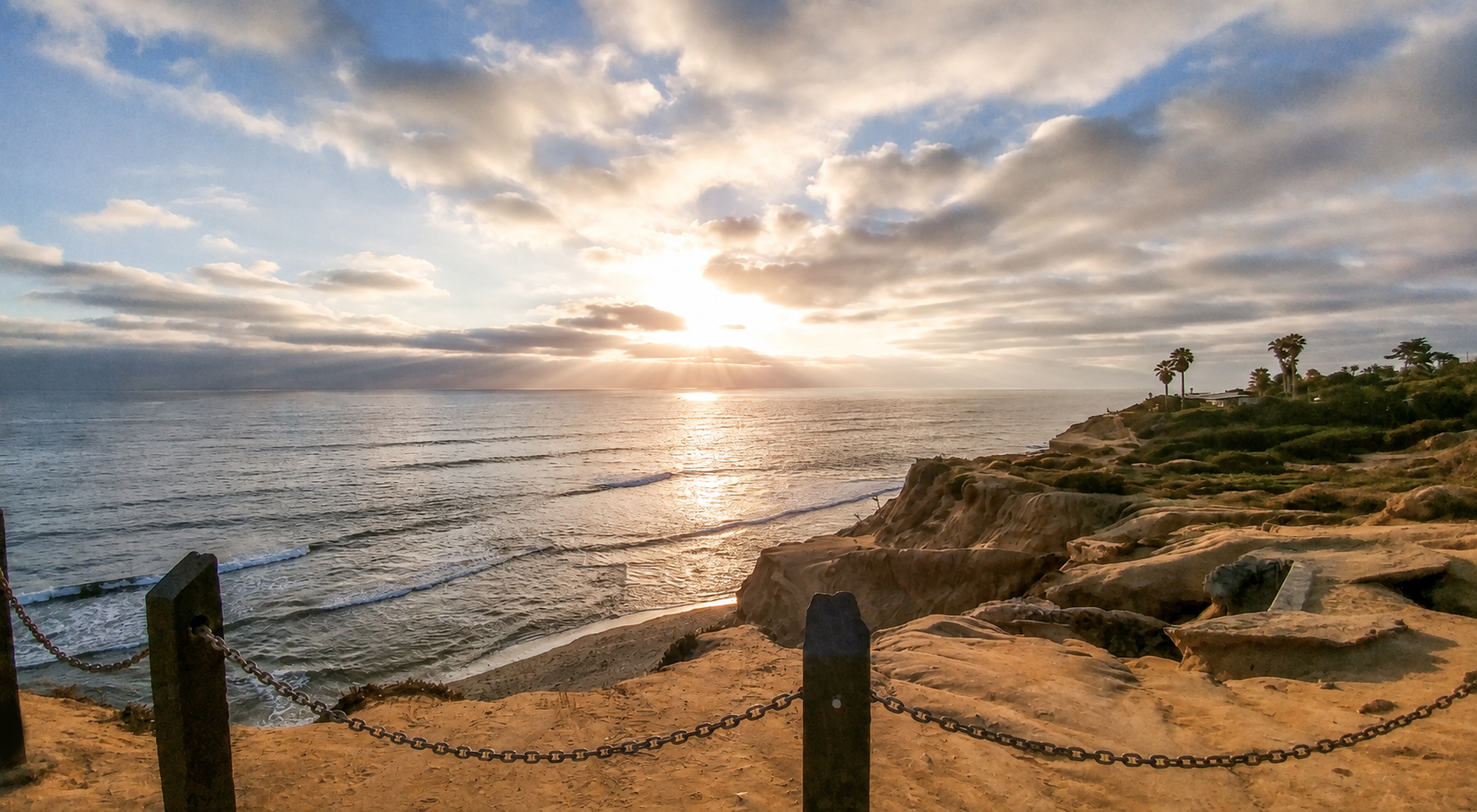 Golden sunset over San Diego’s coastline and ocean cliffs